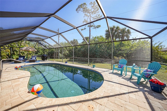 view of pool featuring a gazebo, a patio, and glass enclosure