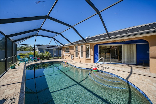 view of pool featuring a lanai and a patio area