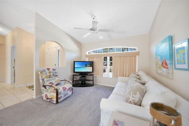 carpeted living room featuring vaulted ceiling and ceiling fan