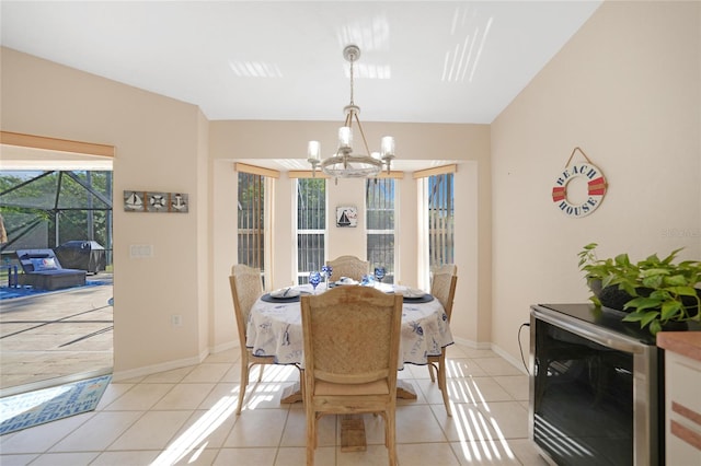 tiled dining space featuring a notable chandelier