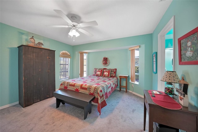 bedroom featuring light colored carpet and ceiling fan