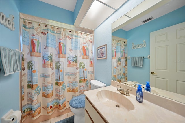 full bathroom featuring vanity, shower / tub combo, tile patterned floors, and toilet