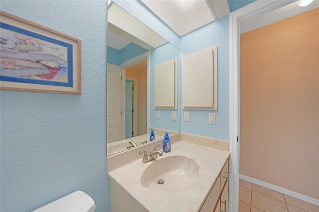 18395 Edgewater Dr, Port Charlotte, FL 33948 - bathroom featuring toilet, vanity, baseboards, and tile patterned flooring