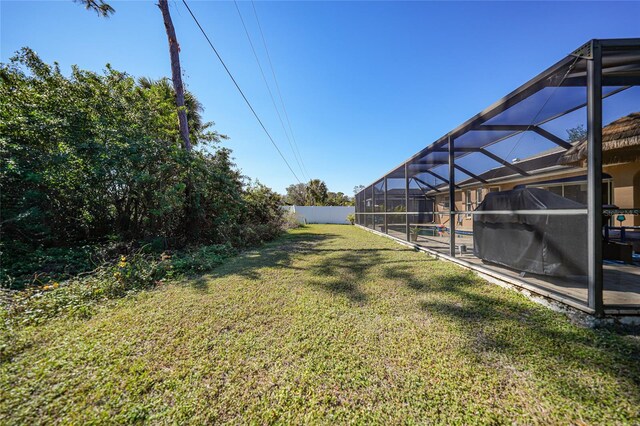 18395 Edgewater Dr, Port Charlotte, FL 33948 - view of yard with a lanai, fence, and a pool