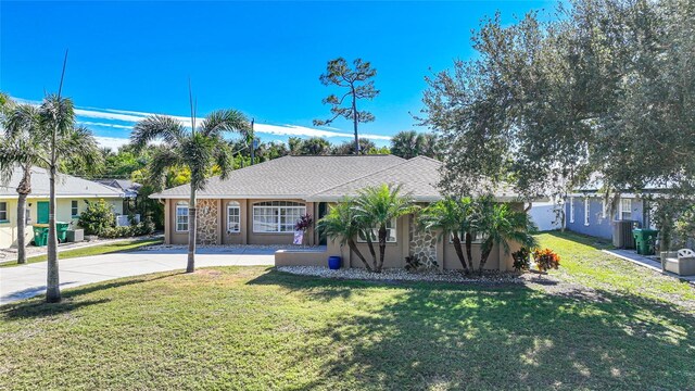 18395 Edgewater Dr, Port Charlotte, FL 33948 - single story home featuring stucco siding, concrete driveway, and a front yard
