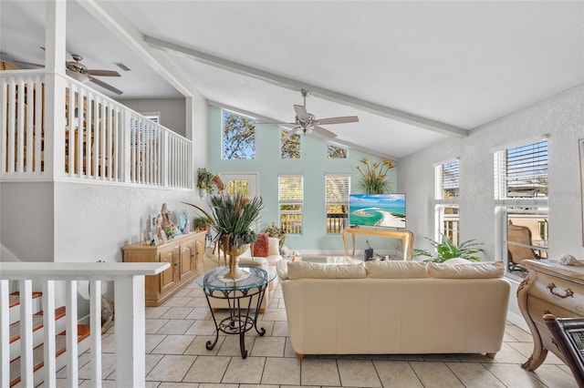 living room with lofted ceiling with beams, light tile patterned floors, and ceiling fan