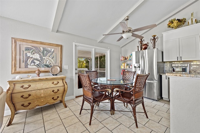 tiled dining space with vaulted ceiling with beams and ceiling fan