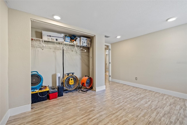 game room with wood-type flooring