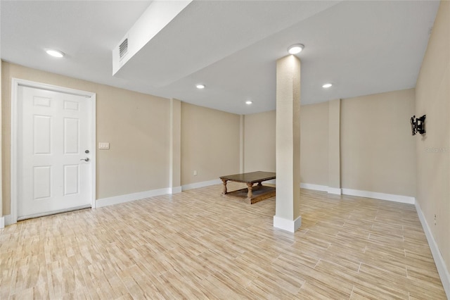 basement featuring light hardwood / wood-style floors