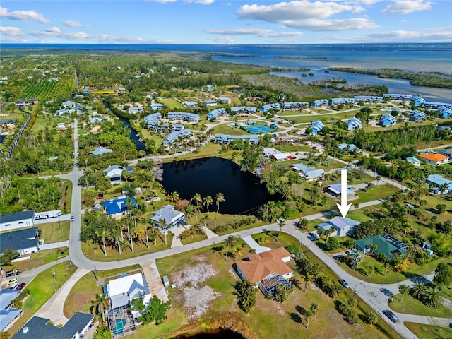 birds eye view of property featuring a water view