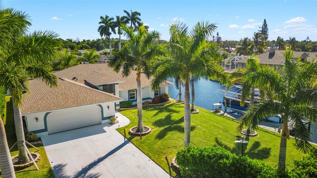 birds eye view of property with a water view