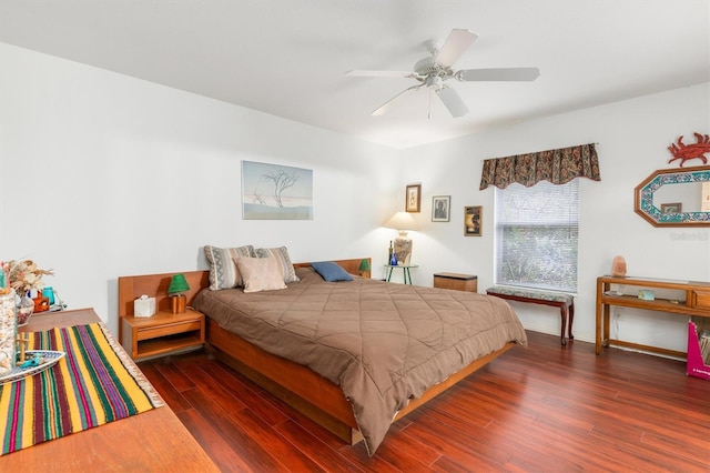 bedroom featuring ceiling fan and dark hardwood / wood-style floors