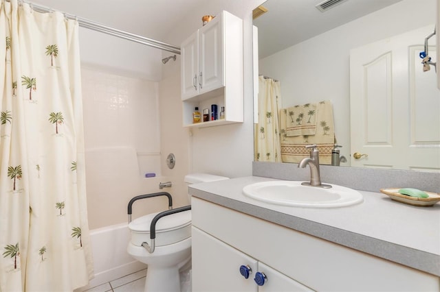 full bathroom with shower / tub combo with curtain, vanity, tile patterned floors, and toilet