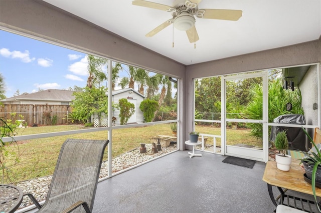 sunroom featuring ceiling fan