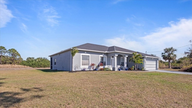 view of front of home with a garage and a front yard