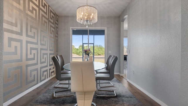 dining space featuring a chandelier and dark hardwood / wood-style flooring