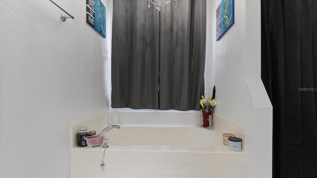 bathroom with tiled tub