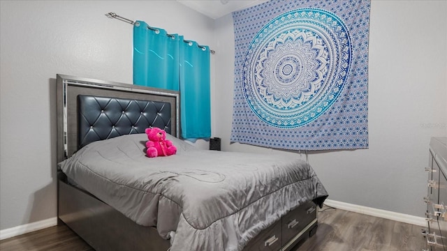 bedroom featuring dark wood-type flooring