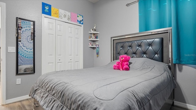 bedroom featuring a closet and hardwood / wood-style flooring