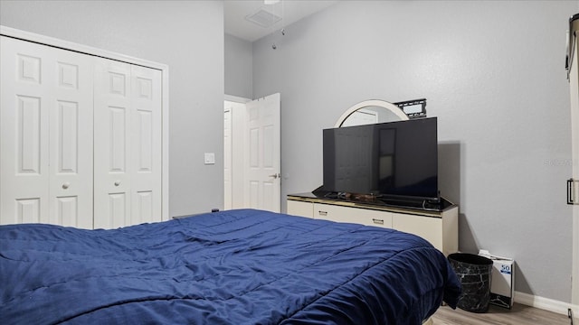 bedroom featuring a closet and light hardwood / wood-style floors