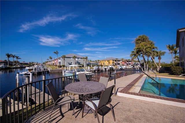 exterior space featuring a patio and a water view