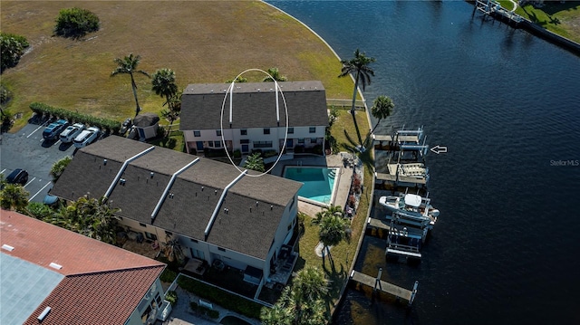 birds eye view of property featuring a water view