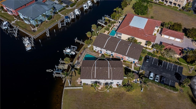 birds eye view of property featuring a water view