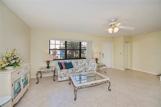 living room featuring ceiling fan and light tile patterned flooring