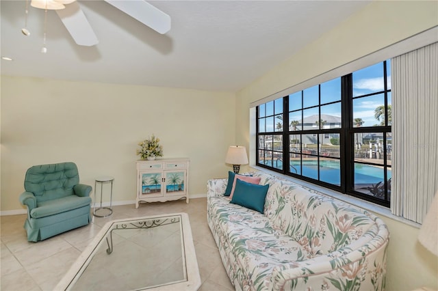 living room featuring light tile patterned flooring and ceiling fan