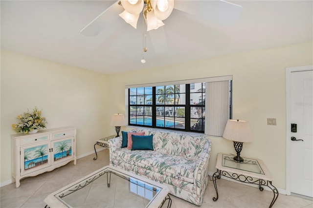 tiled living room with ceiling fan