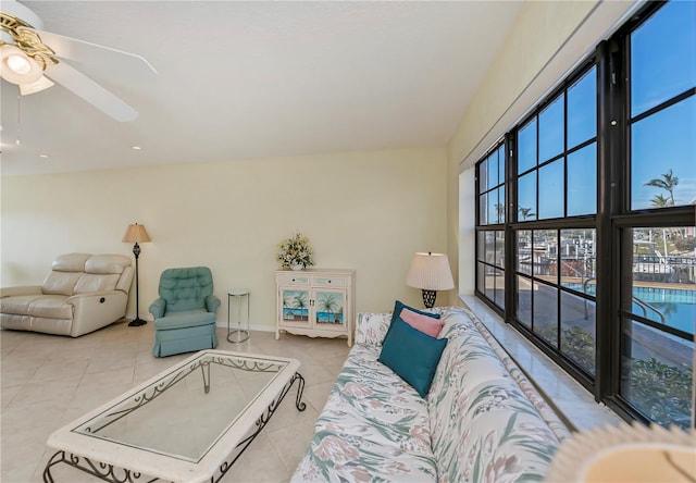 living room with light tile patterned floors and ceiling fan