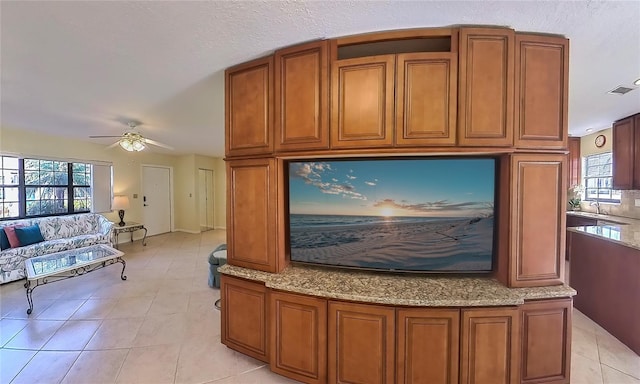 interior space with sink and ceiling fan