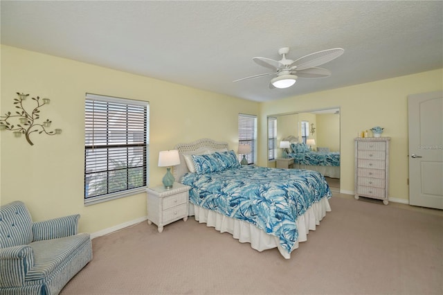 bedroom featuring ceiling fan and carpet floors