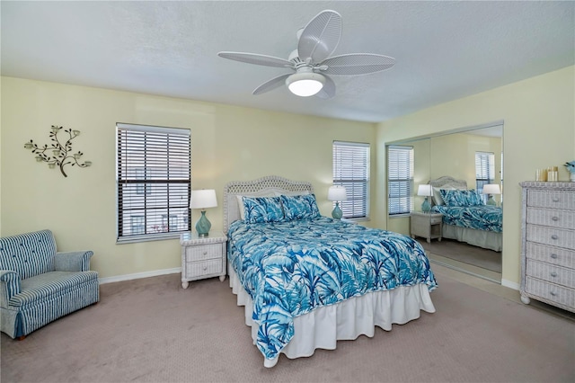 bedroom with ceiling fan and carpet