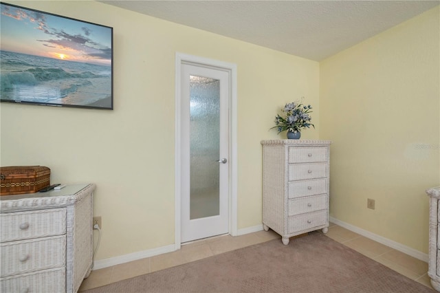 bedroom with light tile patterned floors