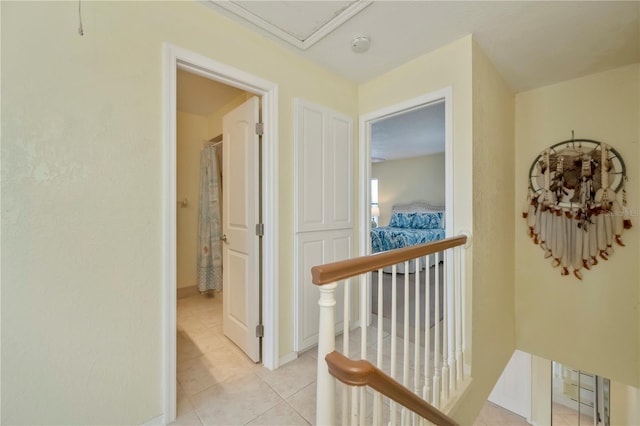 hall featuring light tile patterned floors