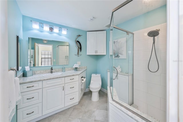 bathroom featuring toilet, vanity, and walk in shower