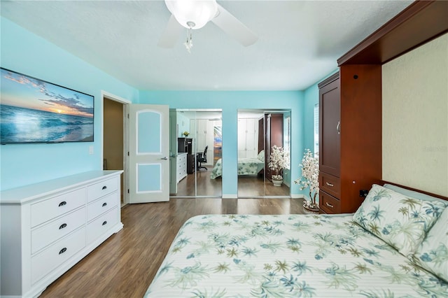 bedroom featuring dark hardwood / wood-style floors and ceiling fan