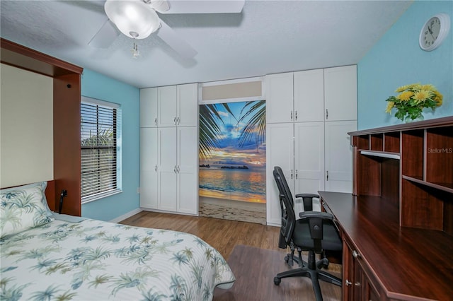 bedroom with light hardwood / wood-style floors, a closet, and ceiling fan