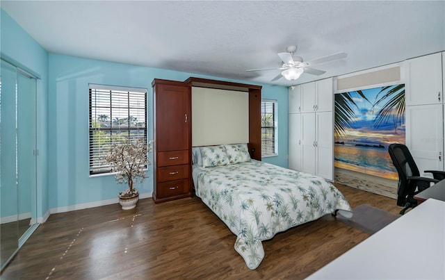 bedroom with ceiling fan and dark hardwood / wood-style flooring