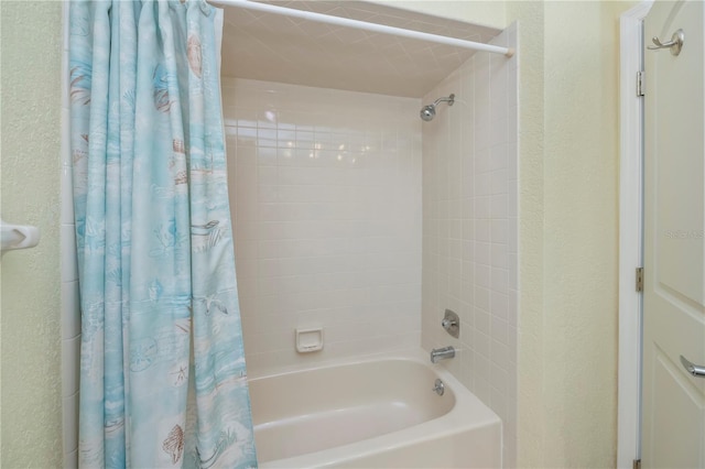 bathroom with shower / bath combo