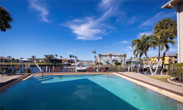 view of pool with a water view