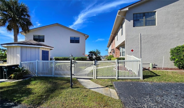 view of side of home featuring a lawn