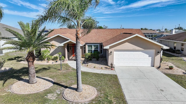 single story home with a garage and a front yard