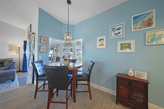 dining room with a notable chandelier and light hardwood / wood-style floors