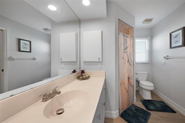 bathroom featuring vanity, toilet, and a shower with shower curtain