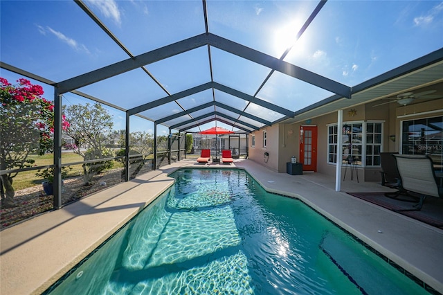 view of swimming pool with a lanai and a patio area