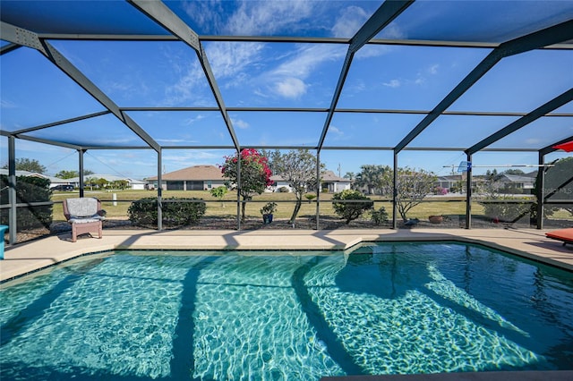 view of pool with a lanai and a patio area