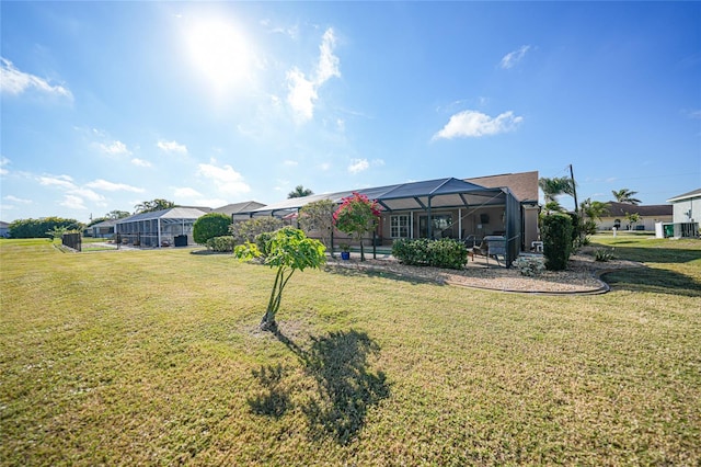 view of yard with a lanai