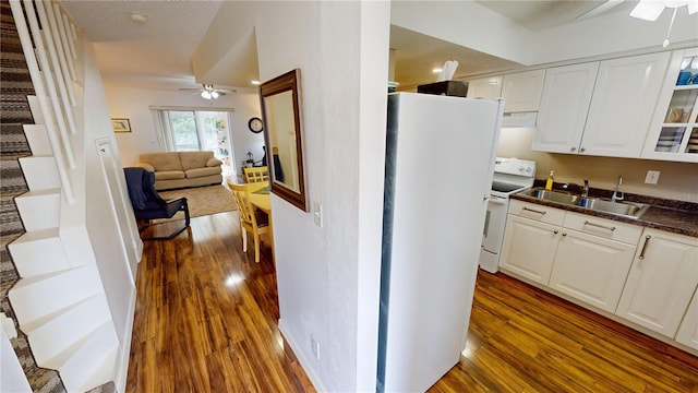 kitchen featuring sink, ceiling fan, white cabinetry, dark hardwood / wood-style floors, and white range with electric stovetop